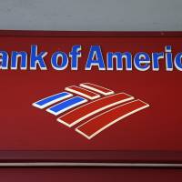 Signage from a Bank of America branch is viewed in downtown Miami, which was hit hard when the U.S. housing market collapsed under the weight of toxic loans. | AP