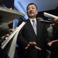 Sharp Corp. President Kozo Takahashi speaks to reporters during a May 12 news conference in Tokyo. | BLOOMBERG