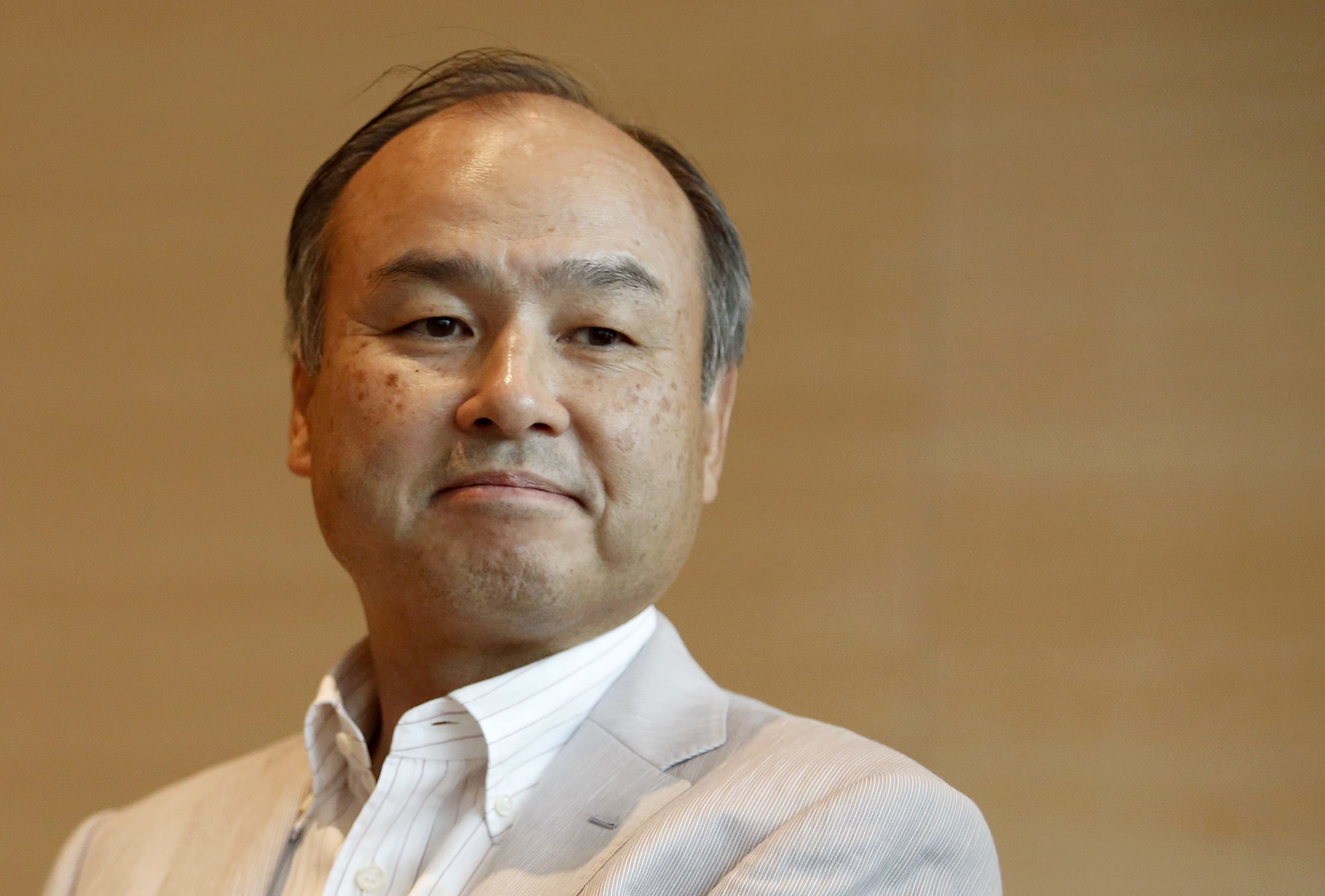 SoftBank Corp. Chief Executive Masayoshi Son attends a roundtable discussion with journalists in Tokyo on June 17. Son hosts the SoftBank Academia, at which budding entrepreneurs meet once or twice a month for business-themed board games and business proposals judged by their peers. | REUTERS