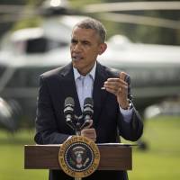 President Barack Obama speaks on the South Lawn of the White House in Washington on Saturday about the ongoing situation in Iraq before his departure on Marine One for a vacation in Martha\'s Vineyard. | AP