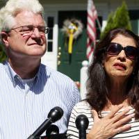 Diane and John Foley talk to reporters Wednesda after speaking with U.S. President Barack Obama outside their home in Rochester, New Hampshire.  Their son, James, was abducted in November 2012 while covering the Syrian conflict. Islamic militants posted a video showing his murder on Tuesday and said they killed him because the U.S. had launched airstrikes in northern Iraq. | AP