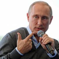 Russian President Vladimir Putin speaks Friday during a youth forum at Lake Seliger, in the north. Putin insisted that Kiev must enter substantial talks with pro-Russian rebels amid a dramatic escalation of the fighting in Ukraine. | AFP-JIJI