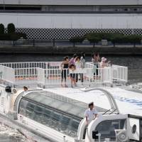 A water bus cruises the Sumida River near Ryogoku Station. | SATOKO KAWASAKI