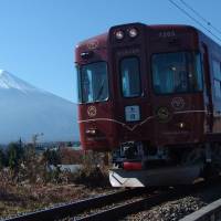 An undated PR photo shows a Fuji Kyuko Co. train with Mount Fuji in the background. Environmental protection key to proposed railway up Mount Fuji