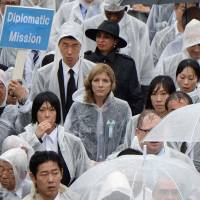 U.S. Ambassador to Japan Caroline Kennedy (center) leaves a memorial service marking the 69th anniversary of the Aug. 6, 1945, atomic bombing of Hiroshima by the United States at the city\'s Peace Memorial Park on Wednesday. | AFP-JIJI