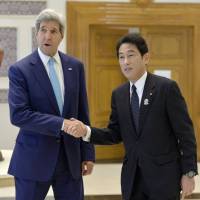 Foreign Minister Fumio Kishida and U.S. Secretary of State John Kerry shake hands in Myanmar\'s capital, Naypyitaw, on Saturday, prior to their talks. The two met on the sidelines of the ASEAN Plus Three regional summit. | KYODO
