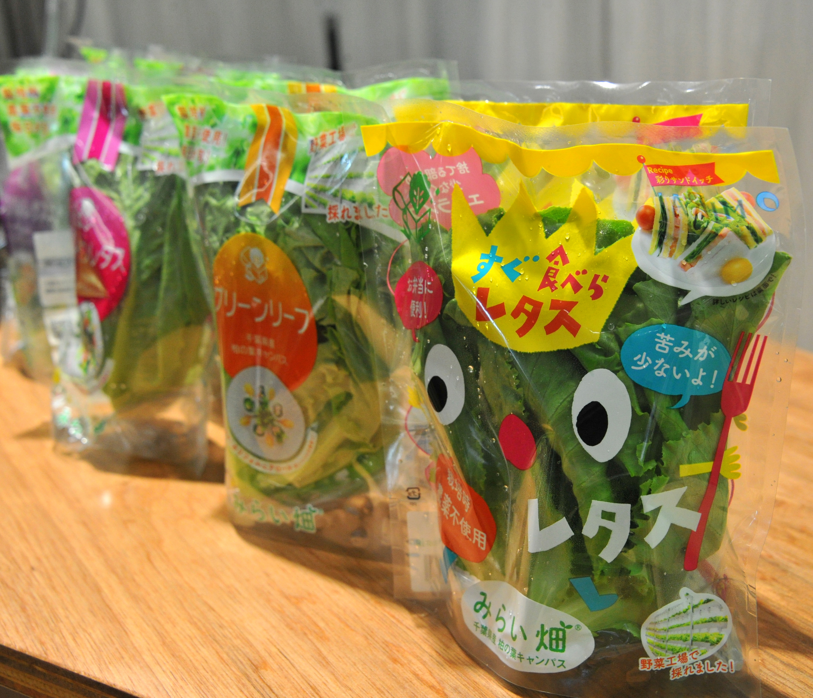 Leafy vegetables that were grown in Mirai Co.'s factory in Kashiwanoha, Chiba Prefecture, are packaged and displayed in June. | YOSHIAKI MIURA