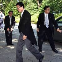 Keiji Furuya (center), chairman of the National Public Security Commission and state minister in charge of North Korea\'s abductions of Japanese nationals, arrives at Yasukuni Shrine on Friday, the 69th anniversary of Japan\'s surrender in World. | AFP-JIJI