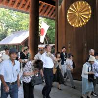 People are seen flowing into Yasukuni Shrine on Friday to pray for the war dead on the 69th anniversary of Japan’s surrender in World War II.   | YOSHIAKI MIURA