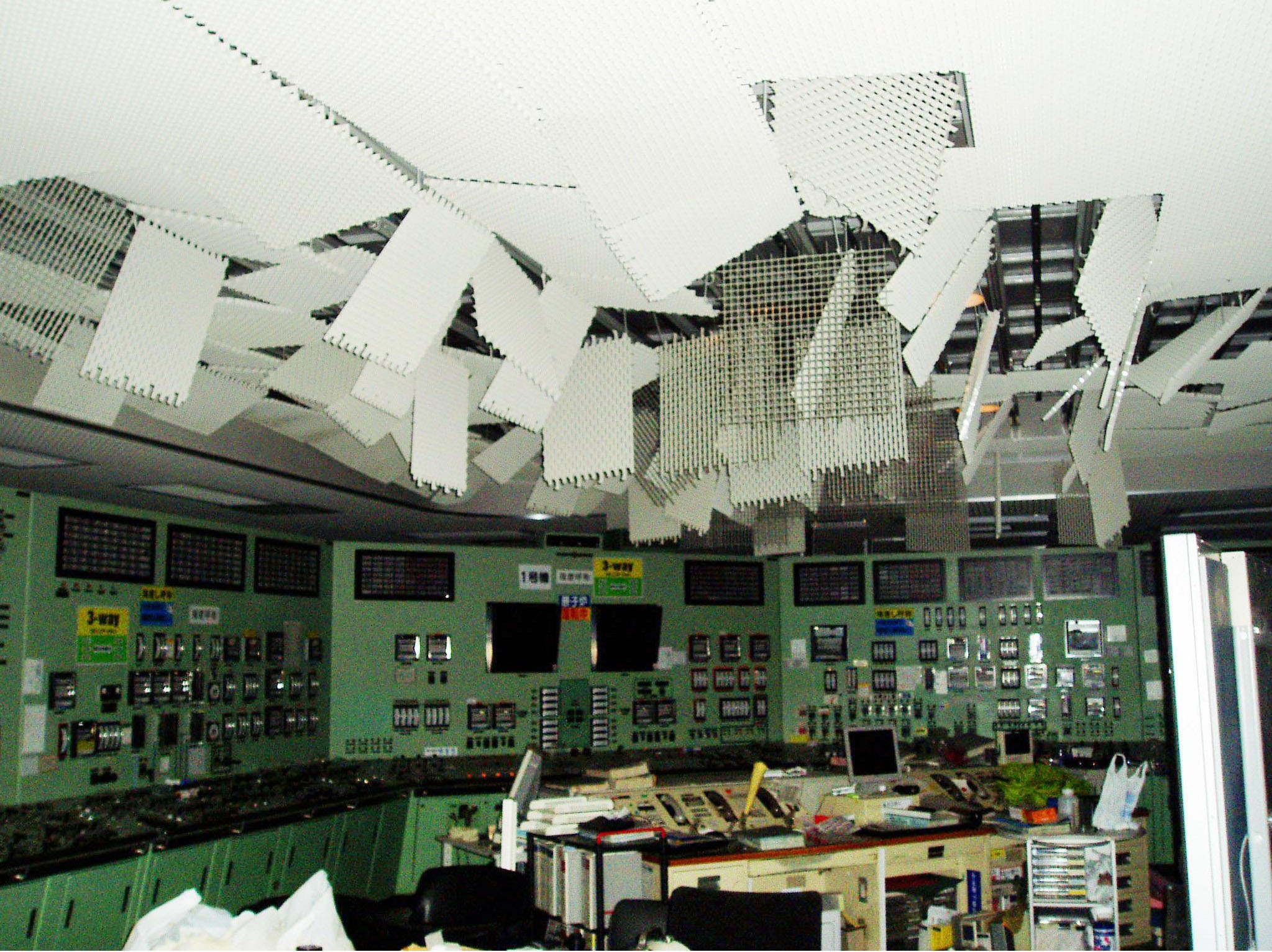 The heavily damaged ceiling in the central control room for reactors 1 and 2 at the Fukushima No. 1 power station is seen on March 12, 2011, in this shot provided by a plant worker. | KYODO