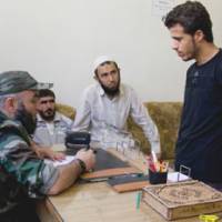 A prisoner is interrogated Aug. 16 by the FSA on suspicion of being a government militiaman. It turned out he was a soldier in the Syrian army. | SHIN YAHIRO