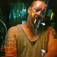Reflections at sea: Capt. Brian Jannelle, here at the controls of his fishing trawler, is one of the human figures in \"Leviathan,\" Lucien Castaing-Taylor and Verena Paravel\'s abstract documentary about commercial fishing. | &#169; ARRETE TON CINEMA 2012