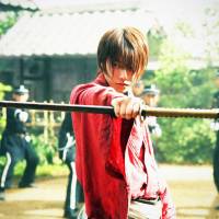 Resisting death: Himura Kenshin (Takeru Sato), a smooth-faced, softly spoken master swordsman in the sequel to \"Rurouni Kenshin.\" | © NOBUHIRO WATSUKI/SHUEISHA C2014”RUROUNI KENSHIN KYOTO INFERNO/THE LEGEND ENDS” FILM PARTNERS