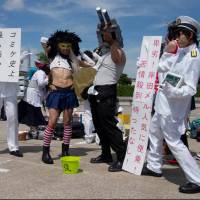 Dressed up for Comiket 86: Group participation is popular among cosplayers, as is “cross-play,” (cross dressing in character), for which Kancolle characters proved popular with both genders. Comiket grows stronger each year