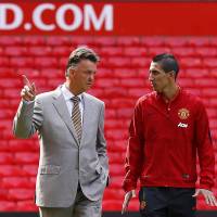 Rebuilding mode: Manchester United\'s new signing Angel di Maria (right) and manager Louis van Gaal will try to steer the Premier League team in the right direction after its stunning 4-0 loss to League One side MK Dons. | REUTERS