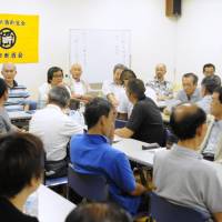 Stand by me: Members of the All Nippon Abstinence Association gather to talk about their recovery in Tokyo. | SATOKO KAWASAKI