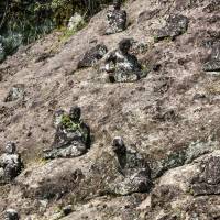 Esoteric resemblance: Stone statues line a hillside on the way to Reigando Cave. | ALON ADIKA