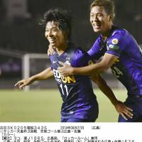 Up for the cup: Sanfrecce Hiroshima\'s Hisato Sato (left) celebrates with teammate Gakuto Notsuda after scoring in Wednesday\'s 1-0 Emperor\'s Cup win over Mito Hollyhock. | KYODO