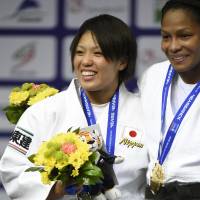 Global recognition: Karen Nun Ira (left) earns a silver medal in the women\'s under-70 kg division at the World Judo Championships on Friday in Copenhagen.  | KYODO