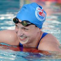 Weekend thrill: Katie Ledecky flashes a smile after setting a world record in the women\'s 400-meter freestyle on Saturday in Irvine, California.  | REUTERS