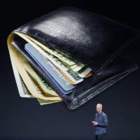 Apple Inc. CEO Tim Cook talks about the Apple Pay e-wallet system during an unveiling event at Flint Center in Cupertino, California, on Tuesday. | REUTERS