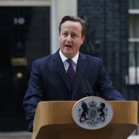 Britain\'s Prime Minister David Cameron speaks to the media Friday in front of Number 10 Downing Street in London regarding the results of the Scottish independence referendum. | REUTERS
