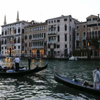 The entrance of the 7-star Aman hotel (second,left) on Venice’s Grand Canal, where it is rumored Hollywood star George Clooney will celebrate his wedding with Amal Alamuddin, is seen Thursday. Clooney, who has been dating Alamuddin since last October, has said the couple intend to host a large official wedding ceremony in the lagoon city in late September. Venice to close Grand Canal walkway area for Clooney wedding