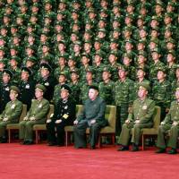 North Korean leader Kim Jong Un (front, center) poses during a photo session with the paratroop units of the Korean People’s Army in this undated picture released by North Korea’s official Korean Central News Agency on Sunday. IAEA sees signs North Korea reactor may be running