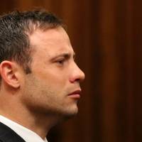 Oscar Pistorius listens to the verdict in his trial at the high court in Pretoria on Friday. | AFP-JIJI