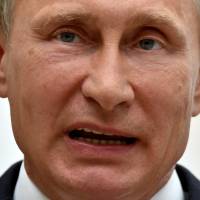 Russia\'s President Vladimir Putin gives a news conference after a summit in Minsk on Aug. 27. Putin and Poroshenko were meeting in Minsk for key talks after the U.S. warned of a \"significant escalation\" in the crisis over Ukraine and Kiev announced the capture of 10 Russian paratroopers. | AFP-JIJI