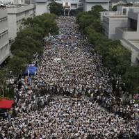 Students stage a rally at the Chinese University of Hong Kong campus in Hong Kong on Monday. | AP