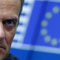 Newly elected European Council President Donald Tusk attends a news conference during an EU summit in Brussels on Saturday. | REUTERS