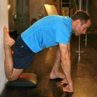 Flex and flexibility: A Chikara CrossFit member stretches before a workout. Coach Michael Schaal teaches stretching that helps increase flexibility. | &#169; RIKA MATSUMOTO / TPT