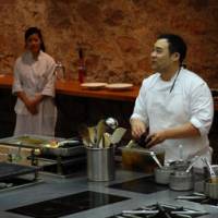 Top chefs: American superstar chef David Chang demonstrates his skills as other participating chefs at the conference observe. | SAMI NOIRI