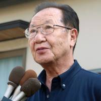 Shigeo Iizuka speaks to reporters outside his home in Ageo, Saitama Prefecture, on Wednesday afternoon. | KYODO