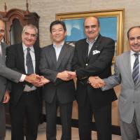 Members of the Council of Arab Ambassadors in Tokyo (from left) Khalil Hassan of Bahrain, Sid Ali Ketrandji of Algeria, Abdul-Rahman Al-Otaibi of Kuwait and Waleed Siam of the Permanent General Mission of Palestine meet Takeharu Tsutsumi, president of The Japan Times, during a courtesy call to the paper on Monday.  | YOSHIAKI MIURA