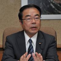 New Environment Minister Yoshio Mochizuki is interviewed Thursday at the ministry in Tokyo. | YOSHIAKI MIURA
