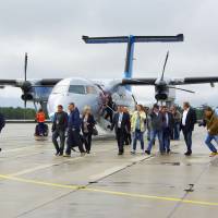Passengers disembark at a newly built airport on Etorofu Island, on the Russian-held islands off Hokkaido, on Wednesday. Russia calls the island Iturup. | COURTESY OF A LOCAL RESIDENT/KYODO