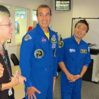 Japanese astronaut Koichi Wakata (right) was reunited with former International Space Station colleague Richard Mastracchio (left), of NASA, at Goddard Space Flight Center in Maryland on Wednesday. | KYODO