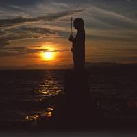 Still waiting: A Jizo statue stands guard over the eastern shore of Lake Shinji, Shimane Prefecture. | STEPHEN MANSFIELD
