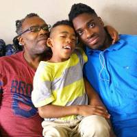 All good: Roler Miles and his sons, Tiki (center) and Dante. \"All the challenges here can’t offset this one benefit of living here: The lack of stress I have because I never have to worry about my sons being shot,\" says Miles.  | COURTESY OF ROLER MILES