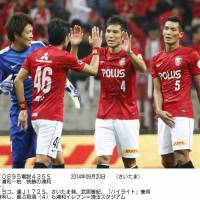 Pleasing result: Urawa Reds players celebrate the team\'s 3-1 win over Kashiwa Reysol on Saturday in Saitama. | KYODO