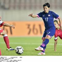 In a rout: Forward Hikaru Naomoto and her teammates cruised to a 9-0 victory over Hong Kong on Friday at the Asian Games. | KYODO