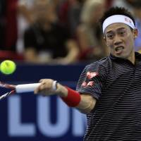On a roll: Kei Nishikori hits a shot during his 7-6 (7-4), 6-4 win over France\'s Julien Benneteau in the final of the Malaysian Open on Sunday. | AP