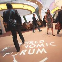 Participants move through the Meijiang Convention and Exhibition Center at the 2012 Annual Meeting of the New Champions in Tianjin, China. | WORLD ECONOMIC FORUM
