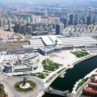 Aerial view of the Tianjin Railway Station surrounded by modern office and residential buildings in Tianjin, China, which will host the Sept. 10 to 12 World Economic Forum\'s Annual Meeting of the New Champions 2014. | WORLD ECONOMIC FORUM