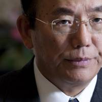 Toshiro Muro, chairman of Daiwa Institute of Research, is interviewed in Tokyo on Jan. 21, 2013. He said Wednesday that the weakening yen hasn\'t been helping smaller companies. | BLOOMBERG
