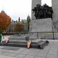Blood is seen at the edge of the Tomb of the Unknown soldier at the National War Memorial in Ottawa on Thursday. Canadians are mourning the loss of Cpl. Nathan Cirillo, the army reservist who was shot dead as he stood guard before the memorial. Flags were flown at half-staff to honor Cirillo, a 24-year-old a reservist from Hamilton, Ontario, whose shooting on Wednesday began an attack that ended with a lone gunman storming into Parliament and opening fire before being shot dead himself. Canada remembers soldier killed in attack