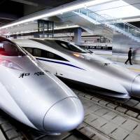 New high-speed inter-city trains used on the line connecting Shanghai and the city of Hangzhou await passengers prior to going into service in October 2010. | BLOOMBERG