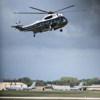 Marine One lands as U.S .President Barack Obama arrives for a meeting at Andrews Air Force Base on Tuesday in Maryland. Obama and Gen. Martin Dempsey, U.S. chairman of the Joint Chiefs of Staff, met with foreign military leaders from 21 countries to discuss solutions for dealing with the Islamic State militant threat. Obama to meet with allies on Islamic State fight